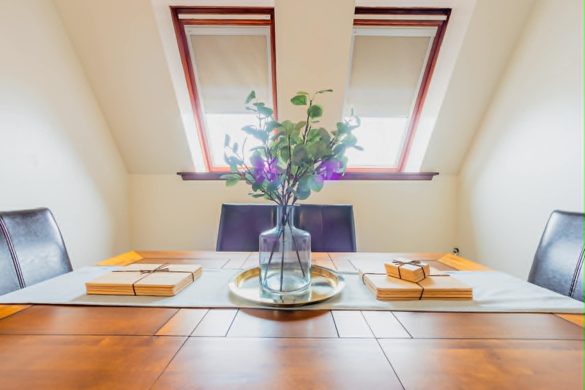 Dining table beneath the apartment skylights
